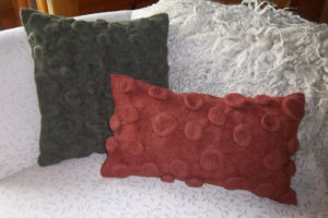 felted pillows made with alpaca yarn by woollymama fiber arts